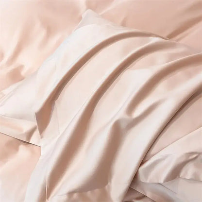 A soft blush pink satin pillowcase from decorbites™ luxurious 1000tc egyptian cotton bedding set with smooth finish