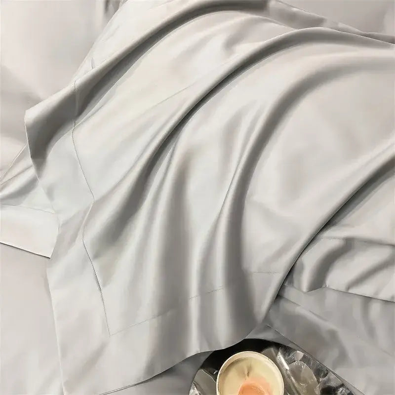 A soft light gray satin fitted sheet from DecorBites™ luxurious 1000TC Egyptian cotton bedding set with subtle sheen