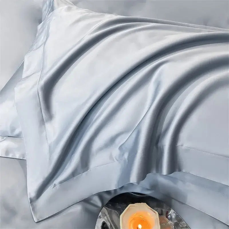 A soft light blue satin pillowcase with glossy finish from decorbites luxurious 1000tc egyptian cotton bedding set