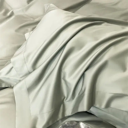 A soft light gray satin pillowcase from the decorbites luxurious 1000tc egyptian cotton bedding set with smooth sheen