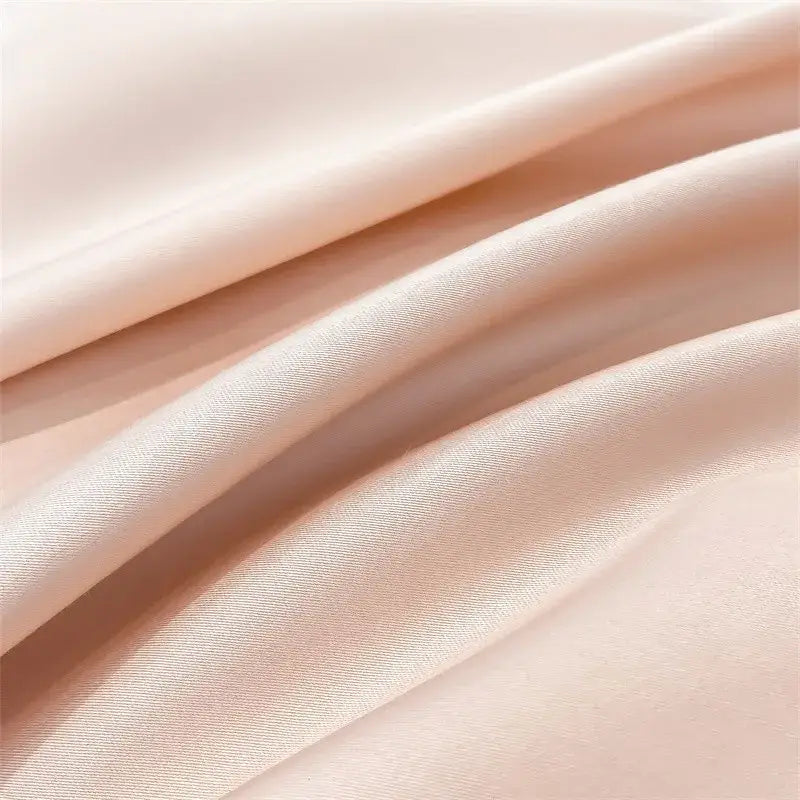 Soft peach satin fabric of the decorbites luxurious 1000tc egyptian cotton duvet cover with subtle glossy sheen
