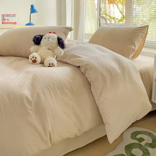 Cream-colored soft textured cotton bedding set with matching pillowcases from decorbites luxurious 4-piece set