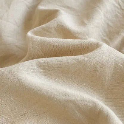 Beige linen fabric with a subtle textured weave in decorbites™ luxurious 4-piece cotton bedding set