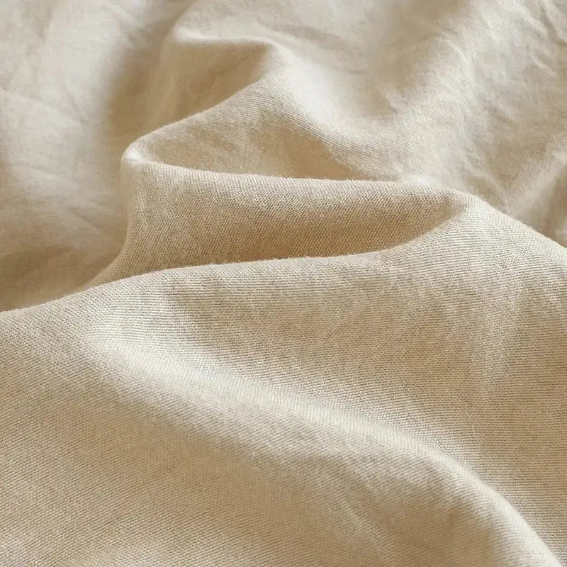 Beige linen fabric with a subtle textured weave in decorbites™ luxurious 4-piece cotton bedding set