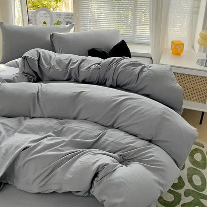 Gray duvet cover set with matching pillows in a soft textured decorbites luxurious 4-piece cotton bedding set