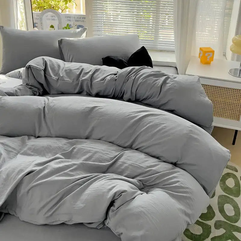 Gray duvet cover set with matching pillows in a soft textured decorbites luxurious 4-piece cotton bedding set
