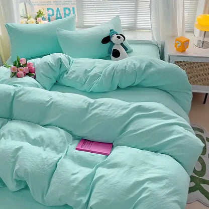 Mint green cotton bedding set from decorbites™ featuring a duvet and pillowcases with a plush dog on the bed