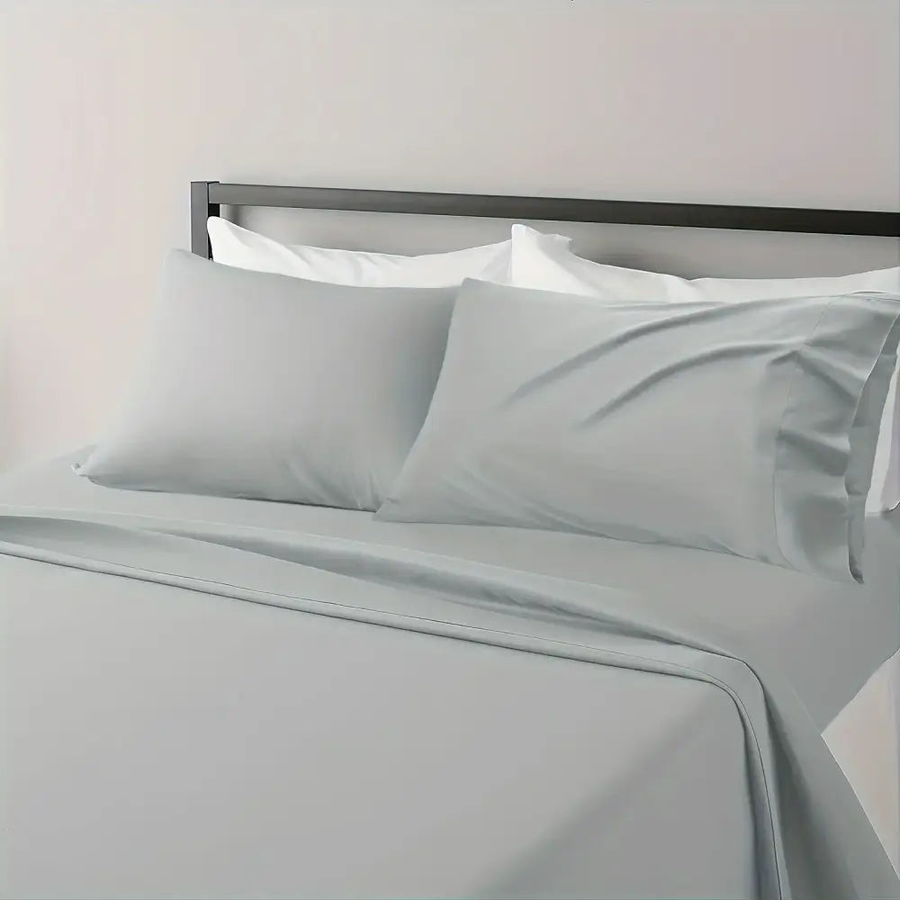 Light gray satin sheet set with matching pillowcases from DecorBites™ luxurious cooling sheet set for breathable comfort
