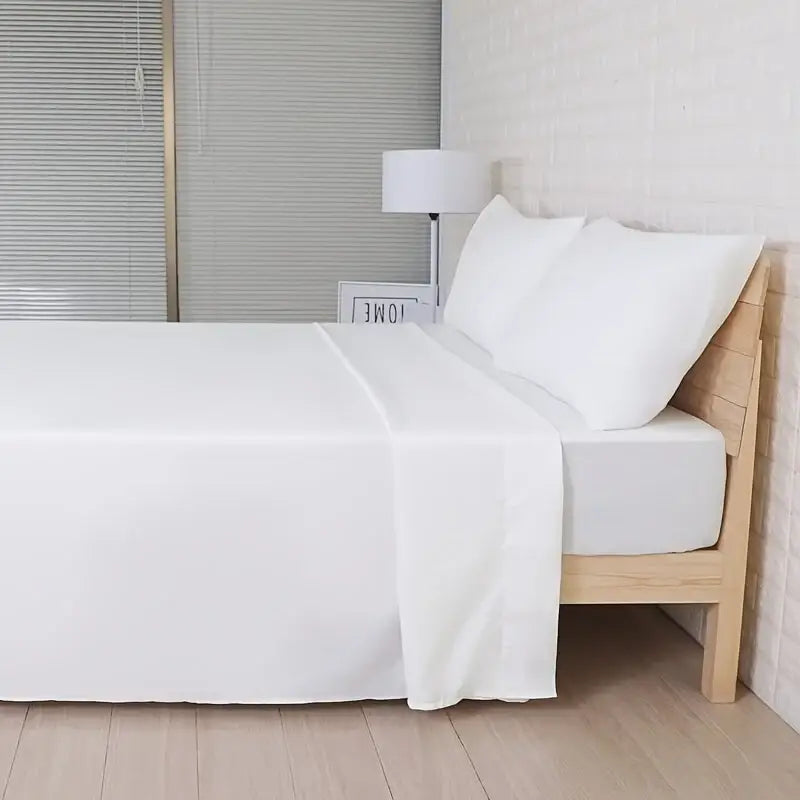 White cotton sheet set from DecorBites™ luxurious cooling sheet set with smooth glossy finish and subtle fold lines