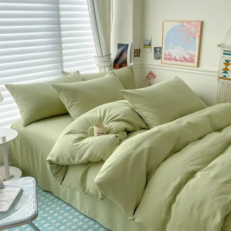 Soft sage green cotton bedding set with matching pillows and cozy duvet cover for single and couple beds by DecorBites