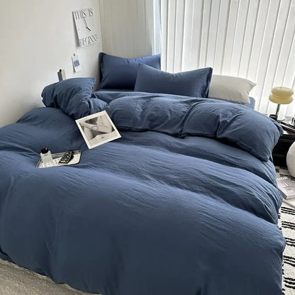 Blue linen-like cotton bedding set from decorbites with matching pillows and cozy slightly wrinkled texture