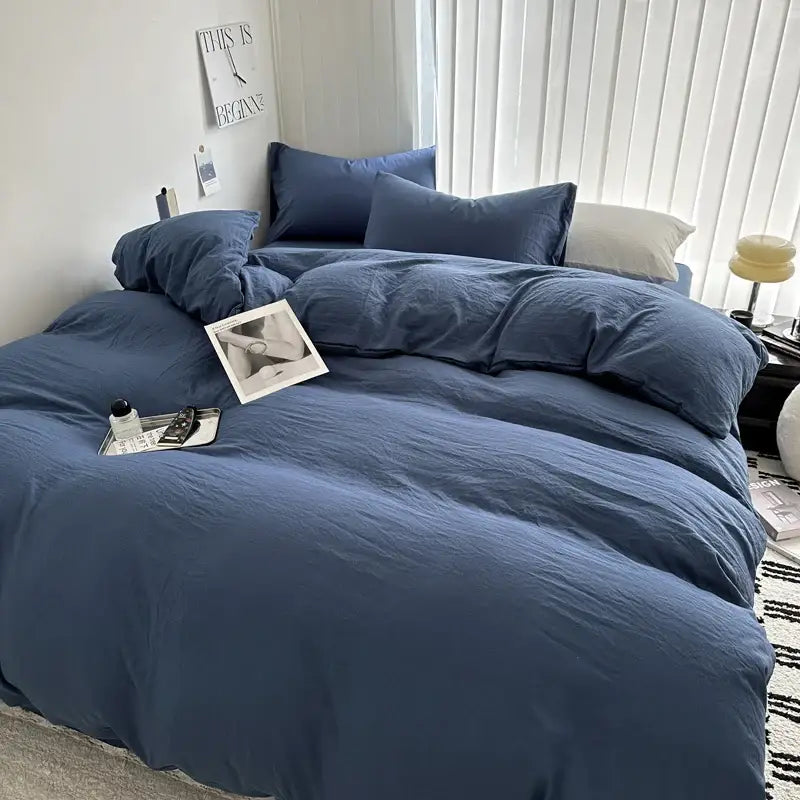 Blue linen-like cotton bedding set from decorbites with matching pillows and cozy slightly wrinkled texture