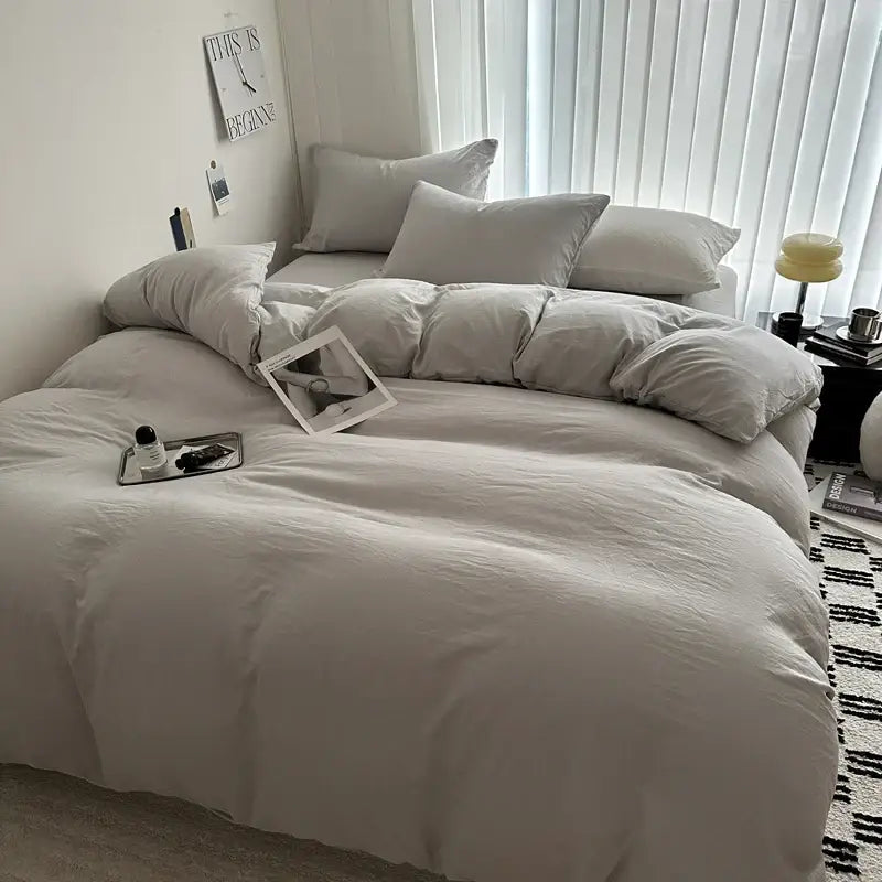 Decorbites™ luxurious cotton bedding set in off-white with soft texture and matching pillows arranged neatly on bed