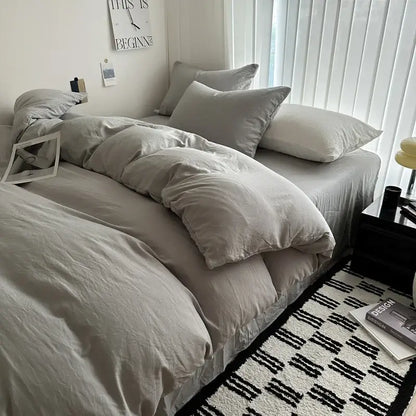 Decorbites™ luxurious cotton bedding set featuring a soft gray duvet cover and matching pillows in neutral tones