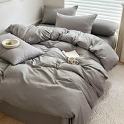 Decorbites™ luxurious gray cotton bedding set with matching pillows featuring a soft smooth fabric finish