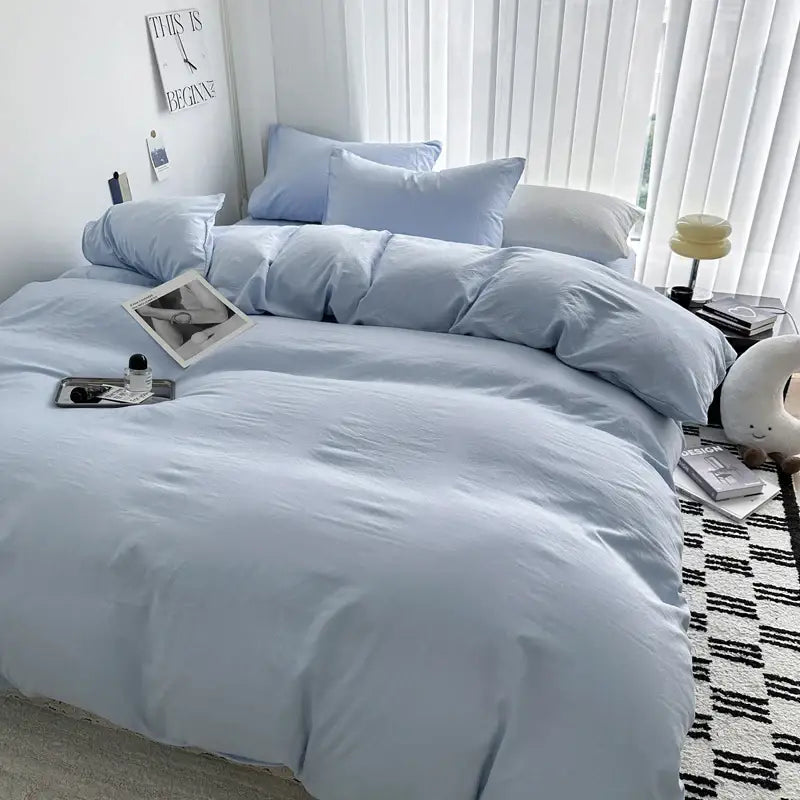 Light blue cotton bedding set from DecorBites Luxurious Cotton Bedding Set featuring soft, cozy texture and matching pillows