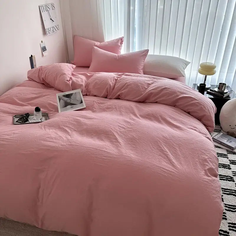 DecorBites™ luxurious pink cotton bedding set with matching pillows and soft slightly wrinkled texture