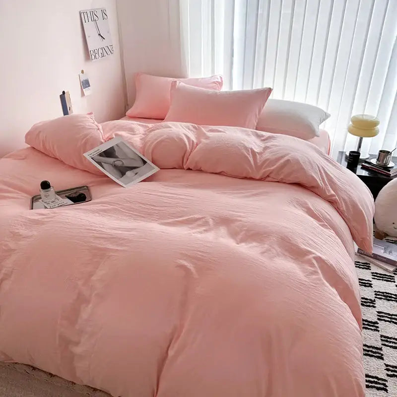 Soft blush pink cotton bedding set with luxurious, cozy, and slightly wrinkled texture by decorbites