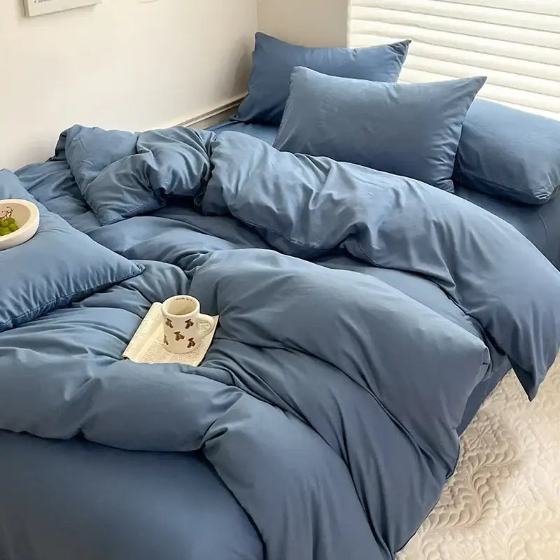 Soft dusty blue quilted cotton bedding set with matching pillows from decorbites luxurious cotton bedding set