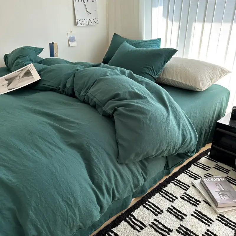 Teal cotton bedding set with soft texture includes rumpled duvet cover and matching pillows by DecorBites™