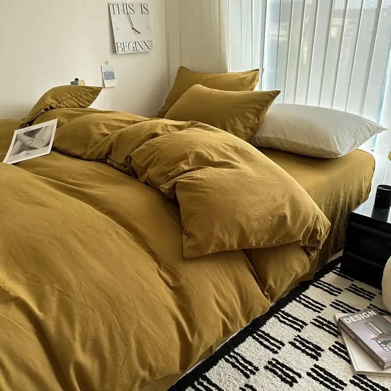 Warm mustard-colored cotton duvet cover and bedding set with soft textured fabric and matching pillows from decorbites