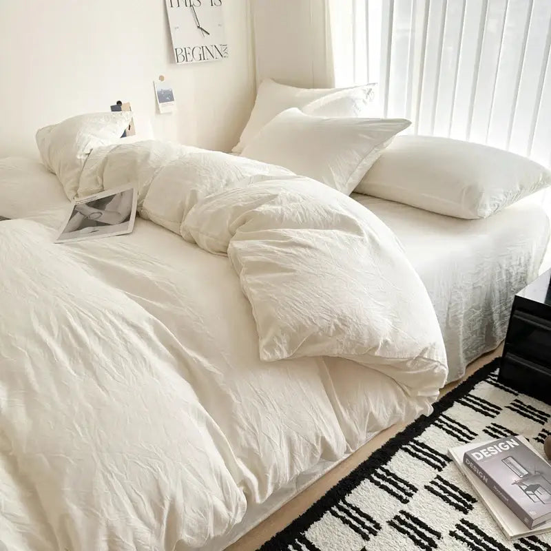 Decorbites™ luxurious white cotton duvet cover set with matching pillows neatly arranged on bed in cotton bedding set