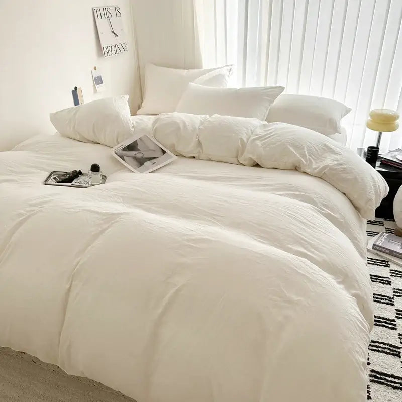 DecorBites™ luxurious white cotton bedding set featuring a plush duvet with soft texture and subtle quilted design