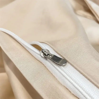 A sleek silver zipper with a metallic pull tab on a beige piece duvet cover from decorbites™ 1000tc egyptian cotton bedding set