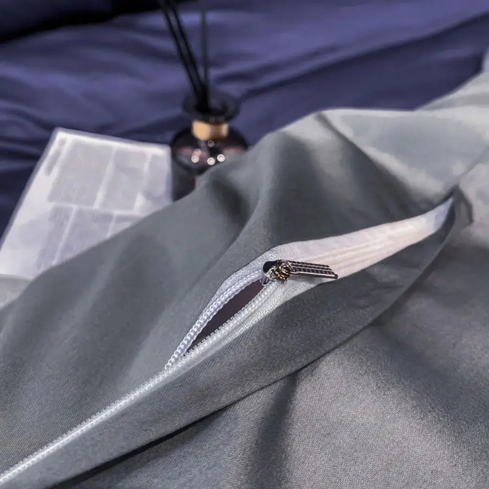 Gray satin pillowcase with white zipper and ornate silver pull tab from decorbites luxurious egyptian cotton bedding set