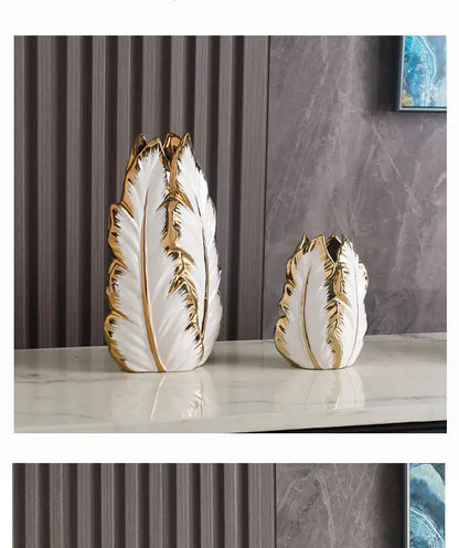 Elegant white ceramic vases with luxurious gold ceramic feather detailing for sophisticated home decor by DecorBites™