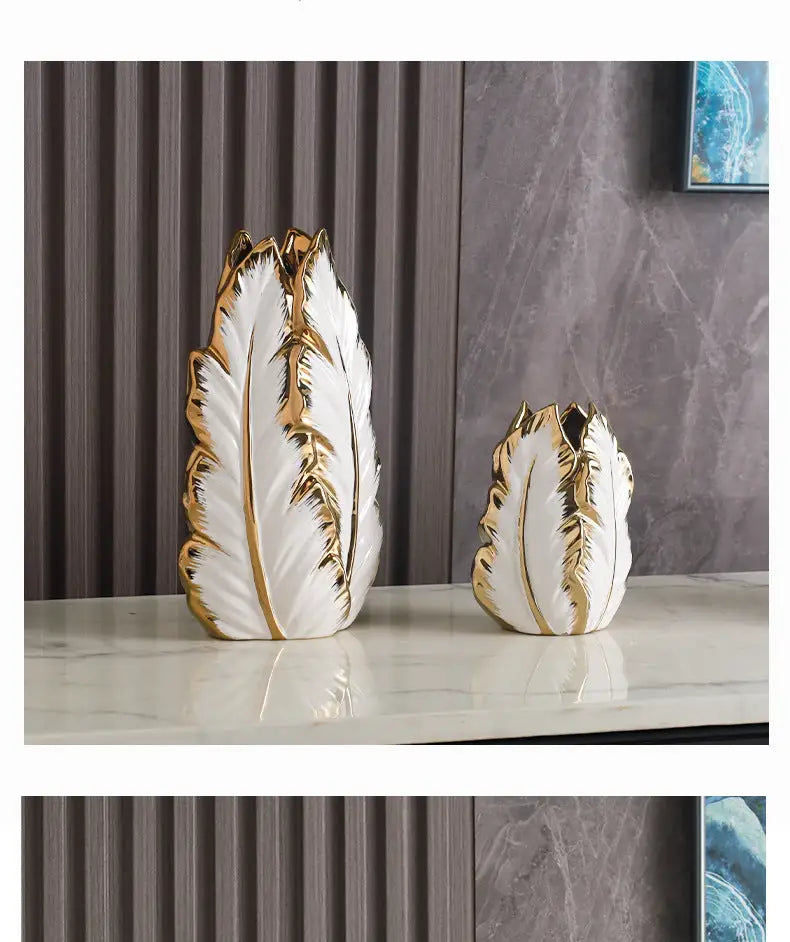 Elegant white ceramic vases with luxurious gold ceramic feather detailing for sophisticated home decor by DecorBites™