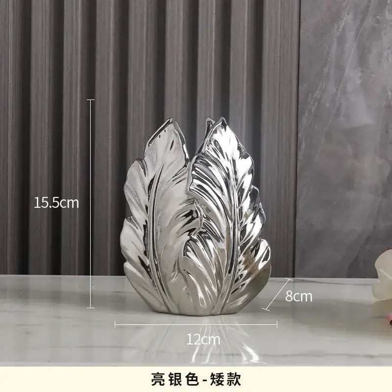 Decorbites™ luxurious gold ceramic leaf-shaped vase with glossy finish and intricate vein details for home decor