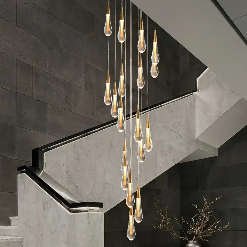 DecorBites™ luxurious gold crystal chandelier features a modern crystal light teardrop pendant with clear glass accents