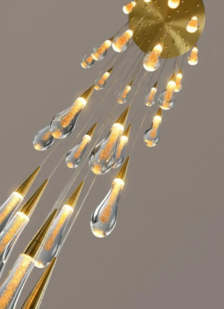 Golden-toned DecorBites™ Luxurious gold crystal chandelier with glowing amber teardrop pendants, perfect modern crystal light