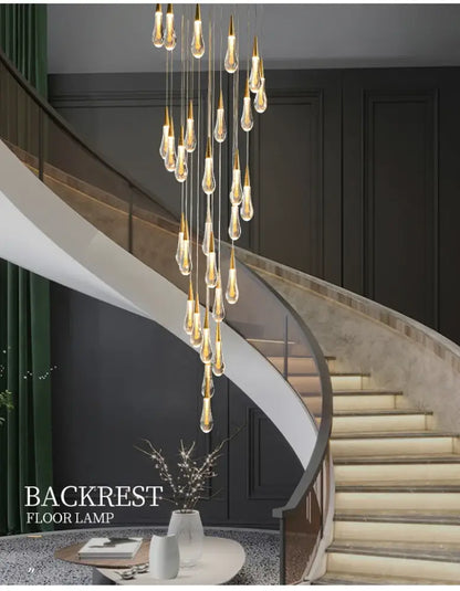 DecorBites™ luxurious gold crystal chandelier with teardrop pendants and warm light as a modern crystal light for staircases