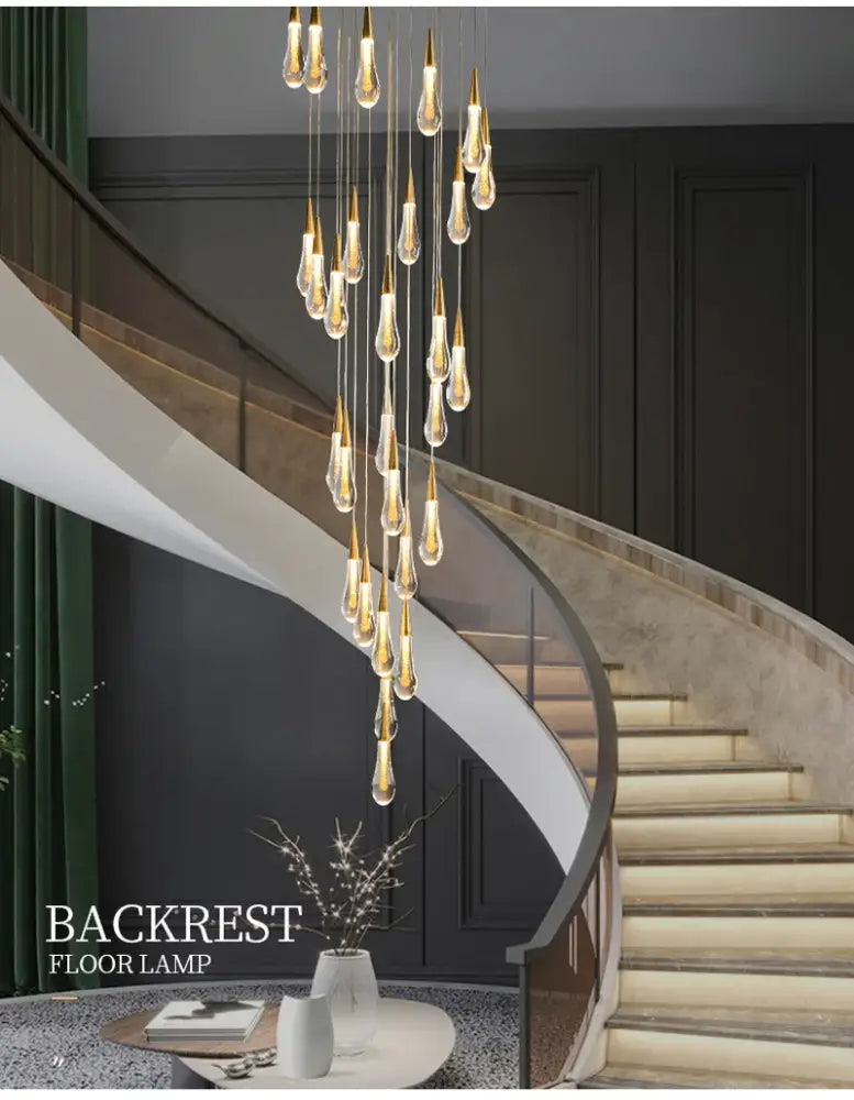 DecorBites™ luxurious gold crystal chandelier with teardrop pendants and warm light as a modern crystal light for staircases