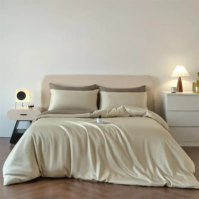 Beige satin duvet cover set with matching pillowcases from DecorBites™ Luxurious Lyocell Silk Bedding Set for queen king size