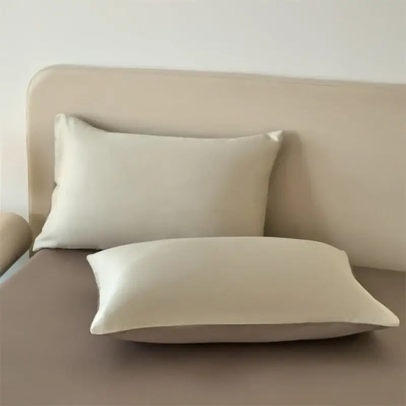 Cream-colored silk pillowcases with a smooth glossy finish from decorbites™ lyocell silk bedding set with duvet cover and sheets
