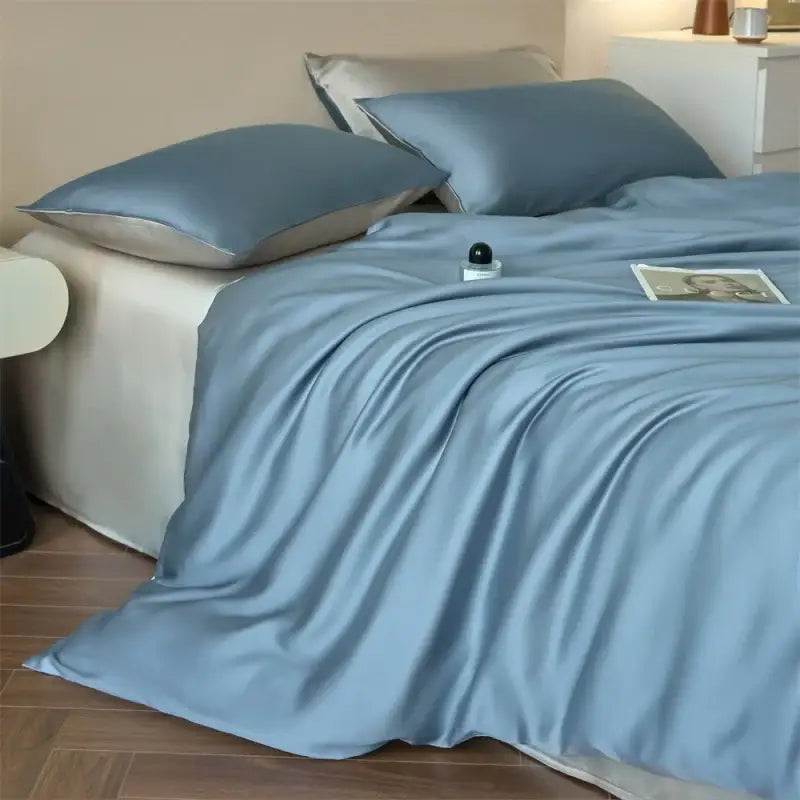 Soft light blue satin duvet cover with subtle sheen and matching pillowcases from decorbites luxurious lyocell silk bedding set