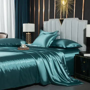 Teal satin duvet cover with glossy finish and matching pillows in decorbites luxurious nordic silk bedding set for couples