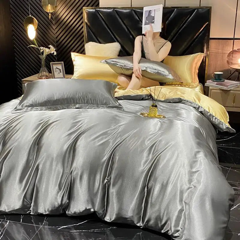 Silver satin rayon silk duvet cover set with matching pillows and gold accents for king size width bed by DecorBites