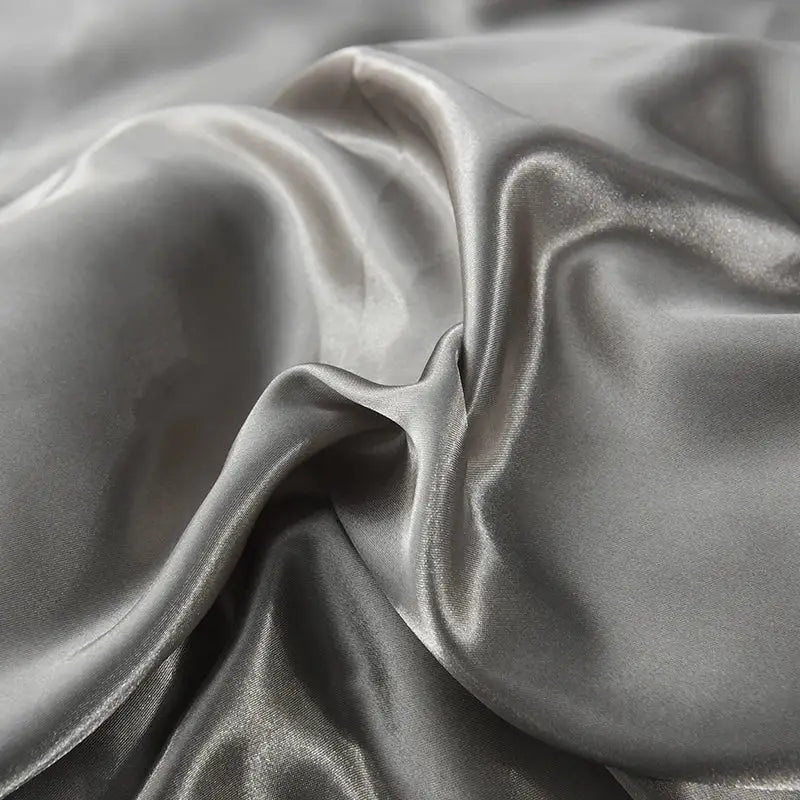 Decorbites™ luxurious silk bedding set in silver gray satin with smooth glossy finish and flowing folds