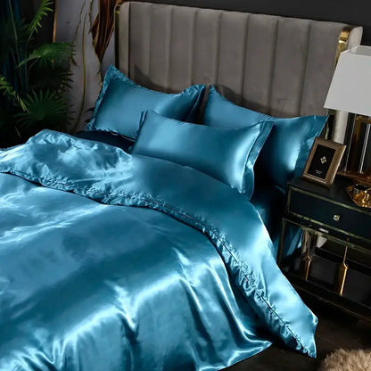 Teal satin silk bedding set with glossy finish and matching pillowcases from decorbites luxurious silk bedding set collection