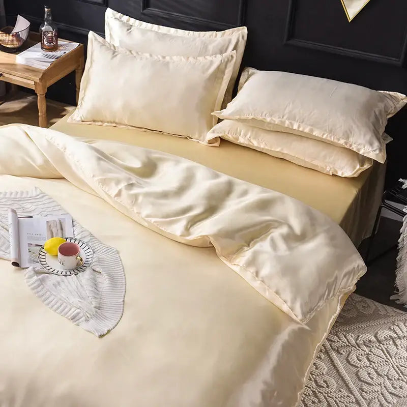 Cream-colored satin silk bedding set from DecorBites™ with smooth glossy finish and elegant stitched edges