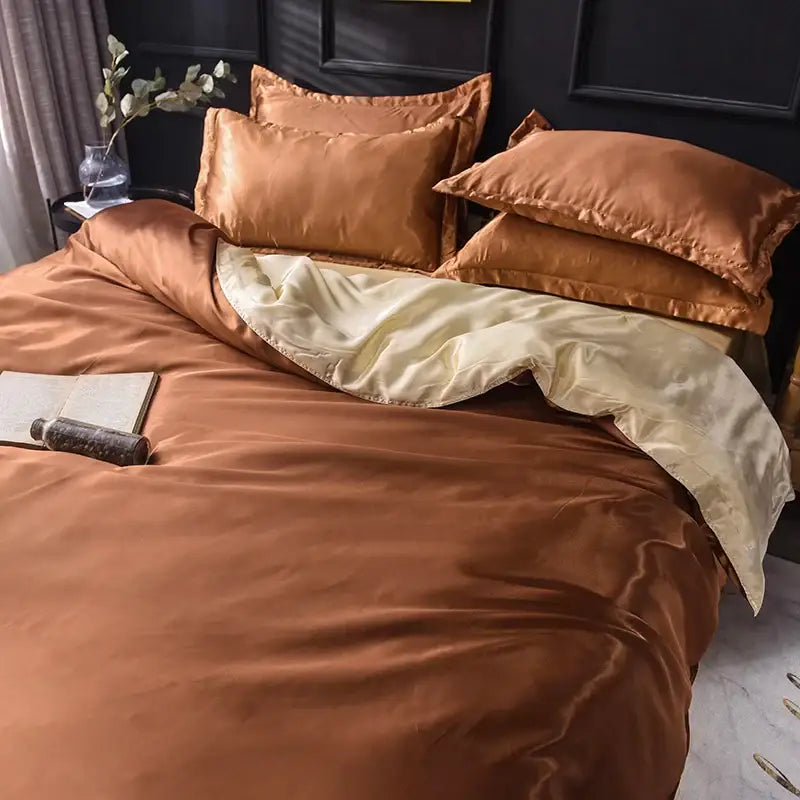 DecorBites™ luxurious silk bedding set in copper-toned satin with cream-colored inner lining for elegant silk bedding