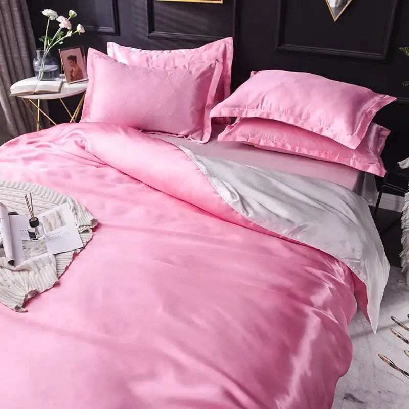 Pink satin duvet cover set with matching pillowcases featuring silver lining from decorbites silk bedding set