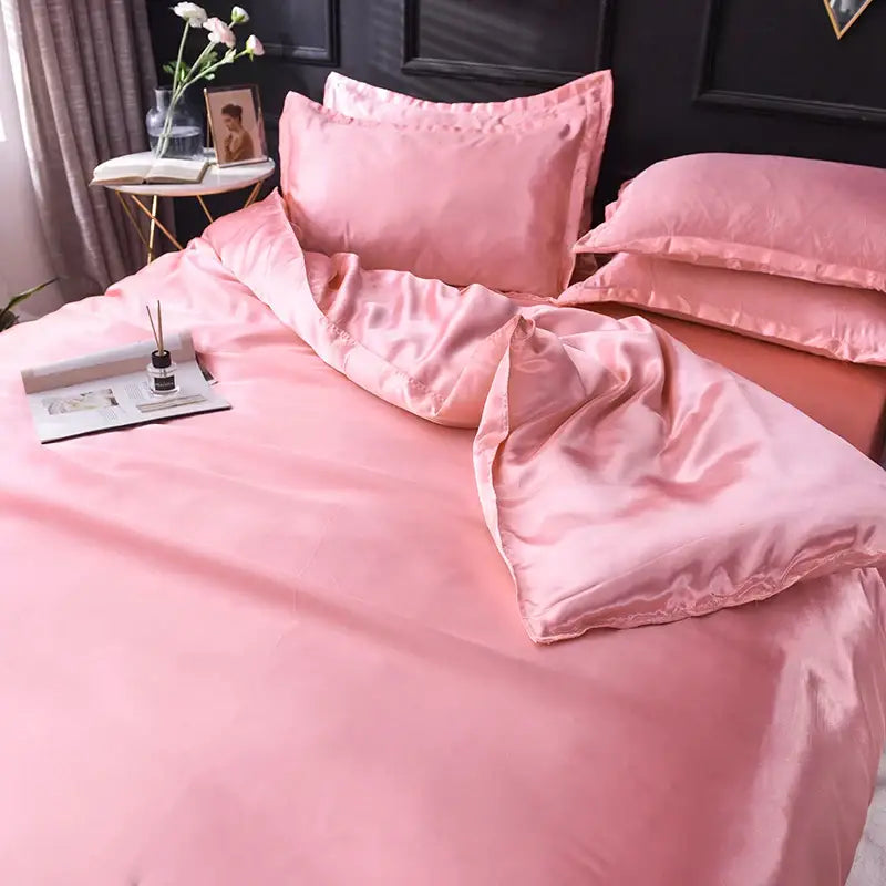 Pink satin silk bedding set with smooth glossy finish and matching pillowcases from decorbites luxurious collection