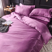 Purple satin silk bedding set from decorbites™ with smooth glossy finish and matching pillows in various sizes