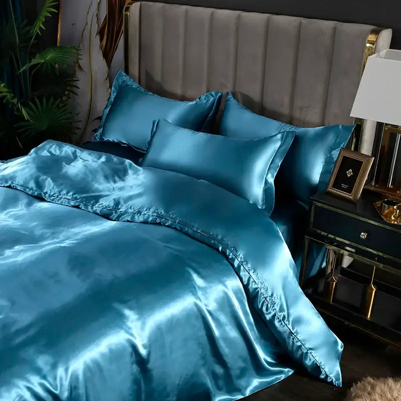 Teal satin silk bedding set with glossy finish and matching pillowcases from decorbites luxurious silk bedding set