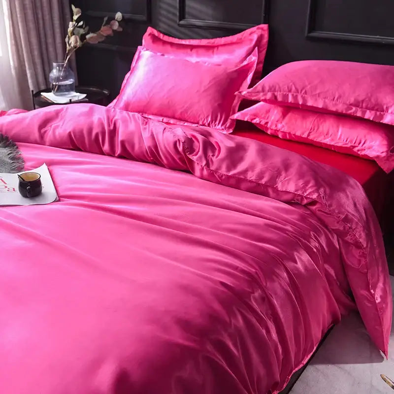 DecorBites™ luxurious silk bedding set in vibrant fuchsia satin with a glossy smooth texture and matching pillowcases